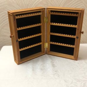 Wooden earring case with black velvet lining.  Case holds 48 pairs of earrings